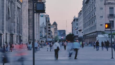 mixkit-street-with-people-walking-at-dusk-3428-hd-ready