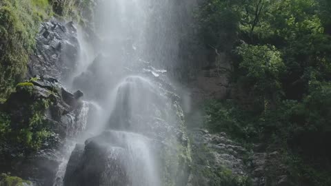 mixkit-waterfall-in-forest-2213-hd-ready